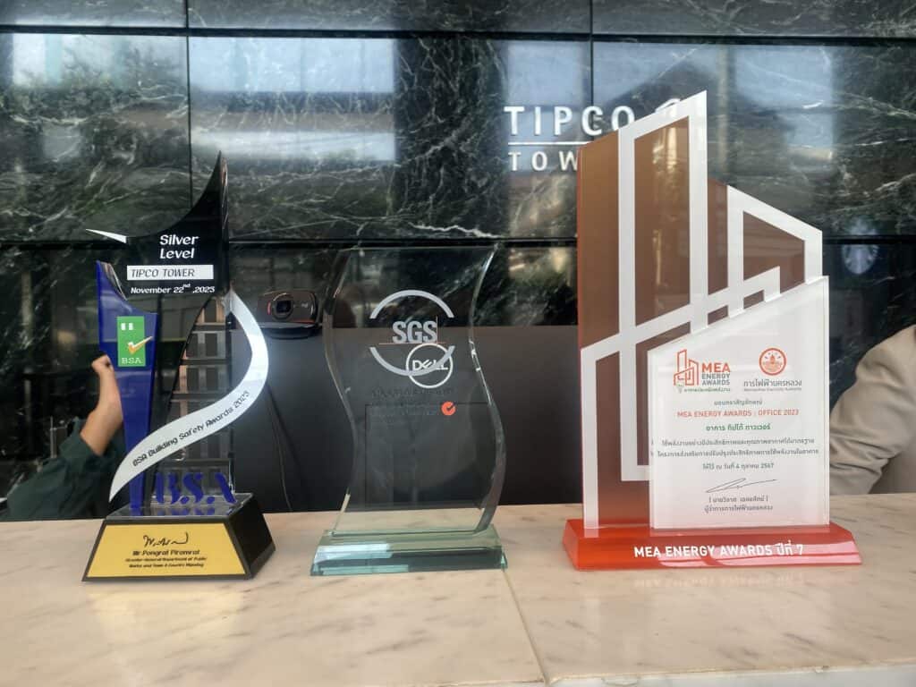 Modern Tipco Tower building with awards and recognition displays.